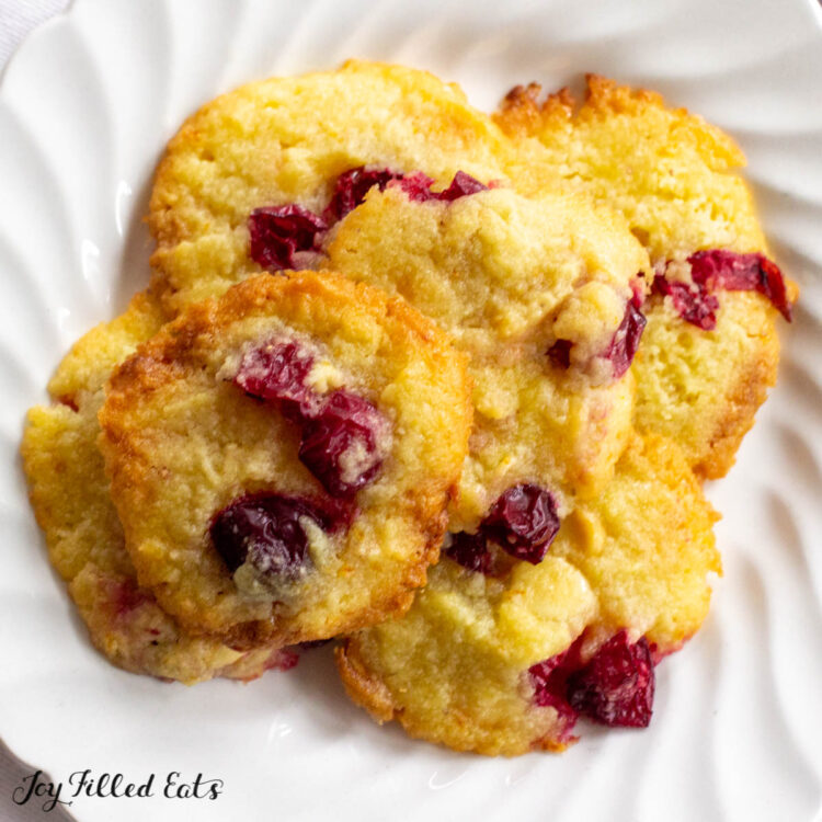 overhead shot of a plate of keto white chocolate cookies with cranberries