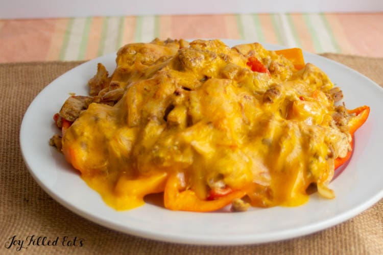 plate of pepper nachos topped with chicken fajita