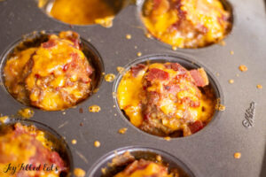 meat baked in muffin tin with bacon and cheese