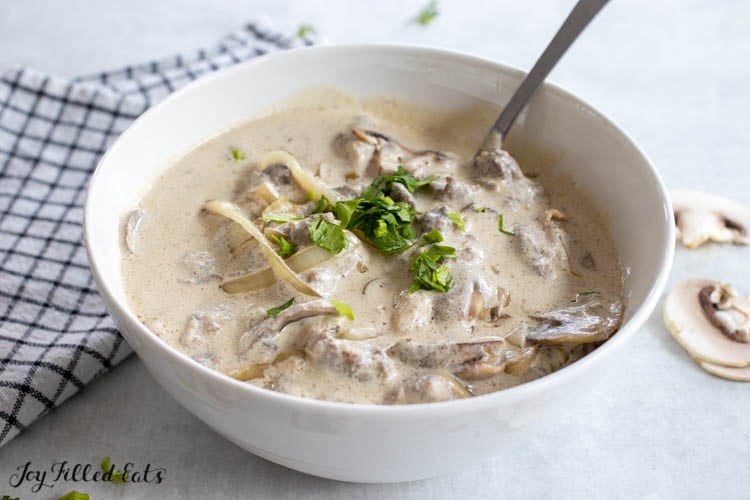 bowl of lamb stroganoff with mushrooms and onions