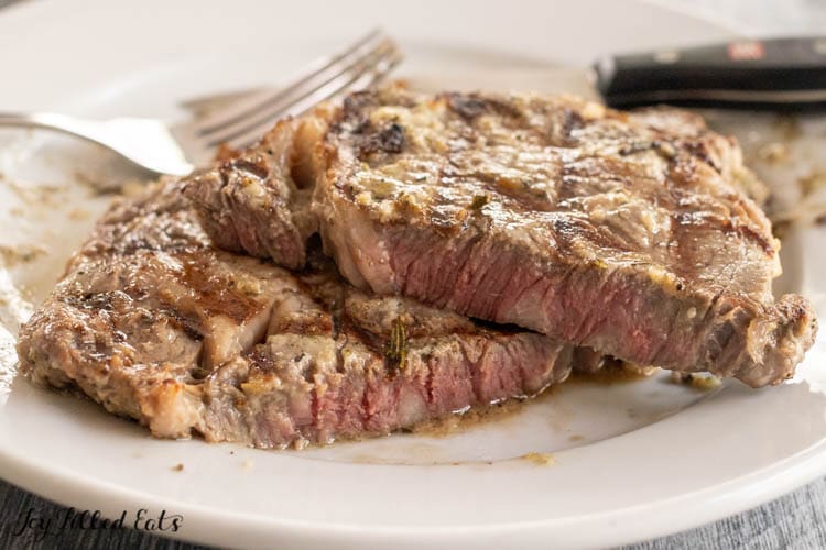 steak cut in half on plate