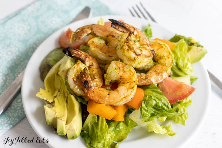 small plate with mexican avocado salad with grilled shrimp