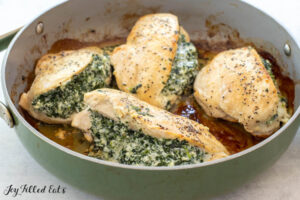 cooked stuffed chicken in skillet