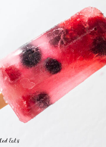 close up of hand holding up one of the sugar-free popsicles