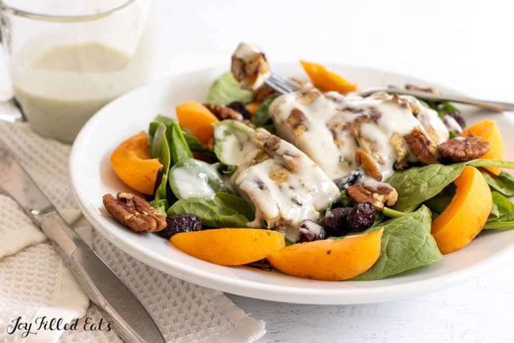 grilled chicken on salad drizzled with gorgonzola vinaigrette
