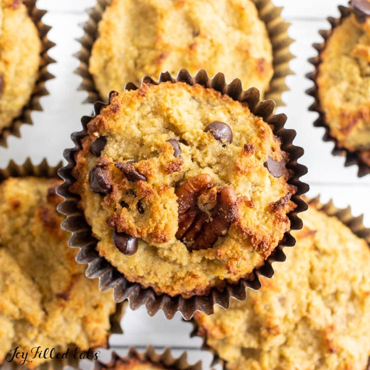 one of the coconut flour banana muffins on top of other muffins