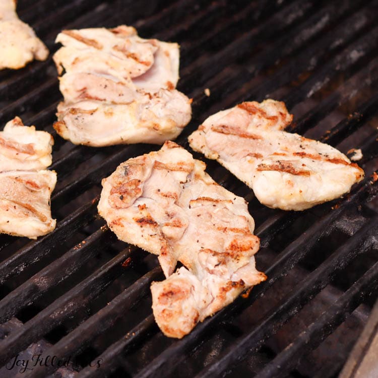 grilled boneless chicken thighs on grill