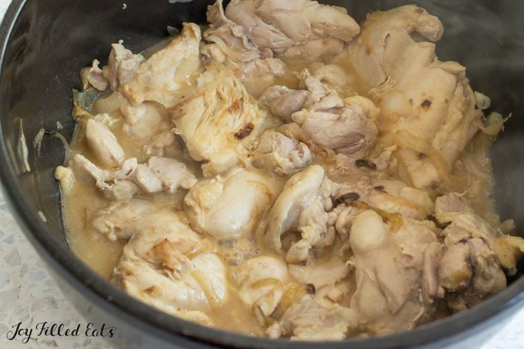 boneless skinless chicken thighs cooking in pot