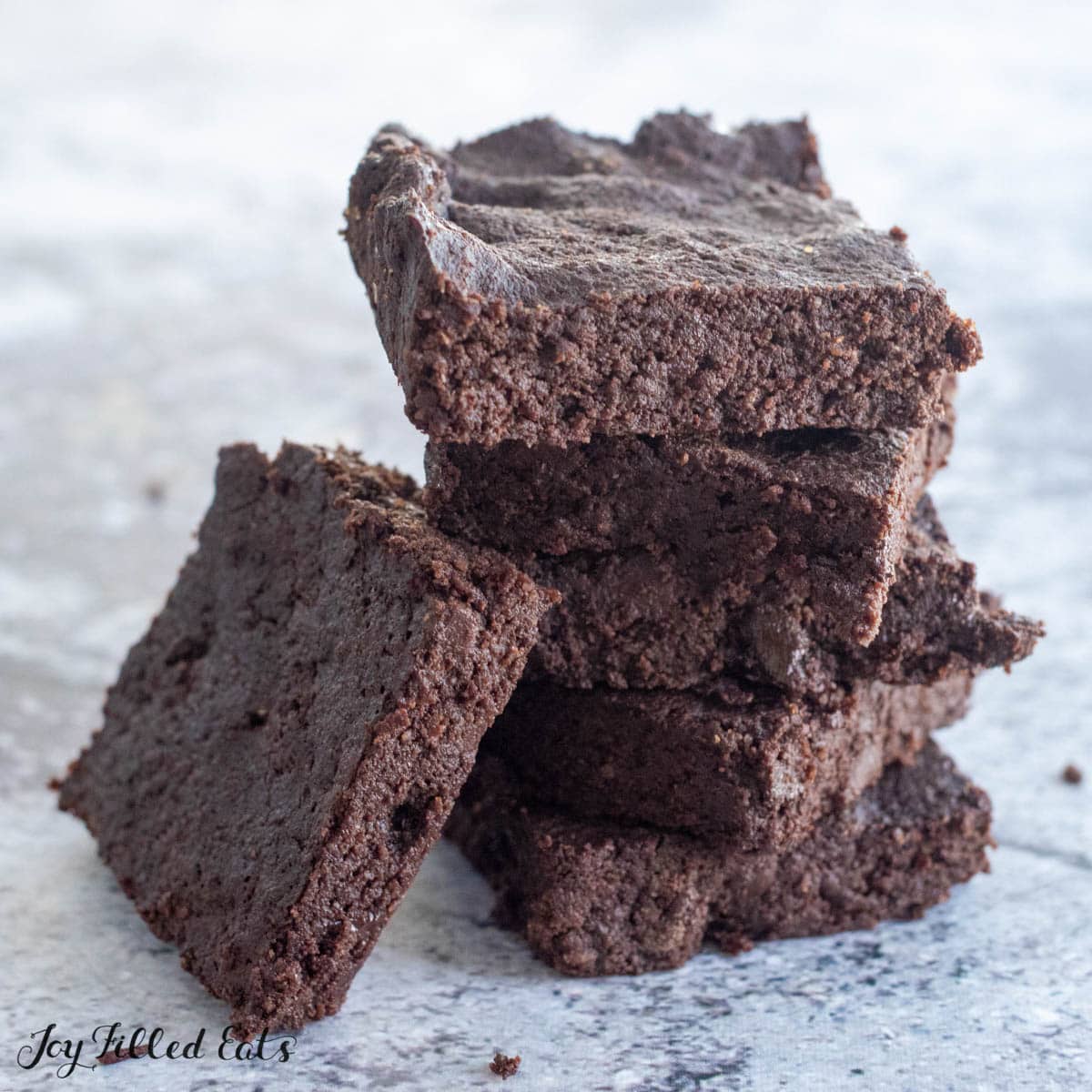 stack of keto coconut flour brownies close up