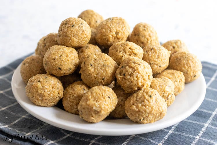 peanut butter bliss balls on plate from side