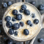 protein overnight oats topped with blueberries close up