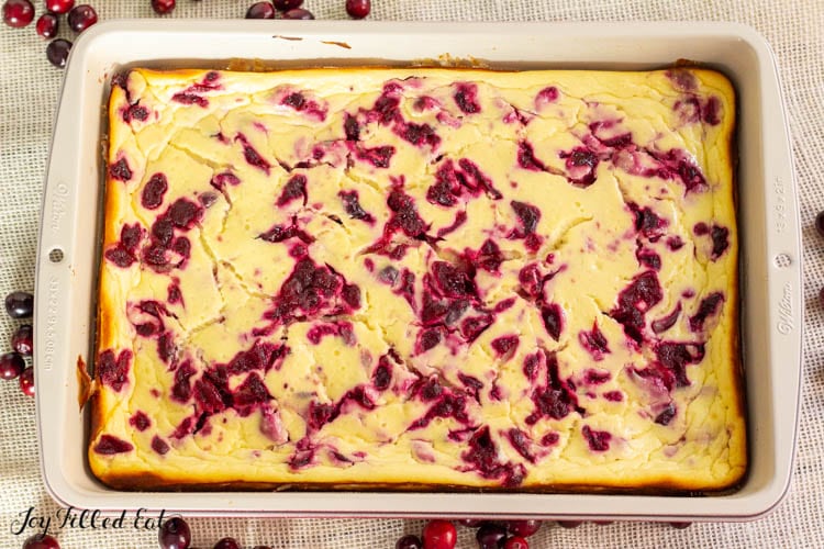 baked cranberry cheesecake bars in baking pan
