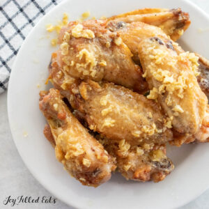 garlic butter chicken wings on a white plate
