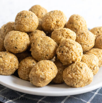 pile of peanut butter bliss balls on a plate