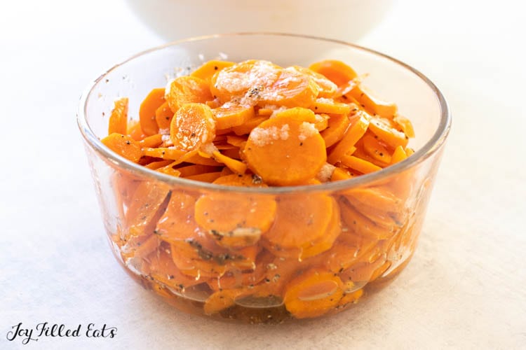 bowl of carrots in dressing