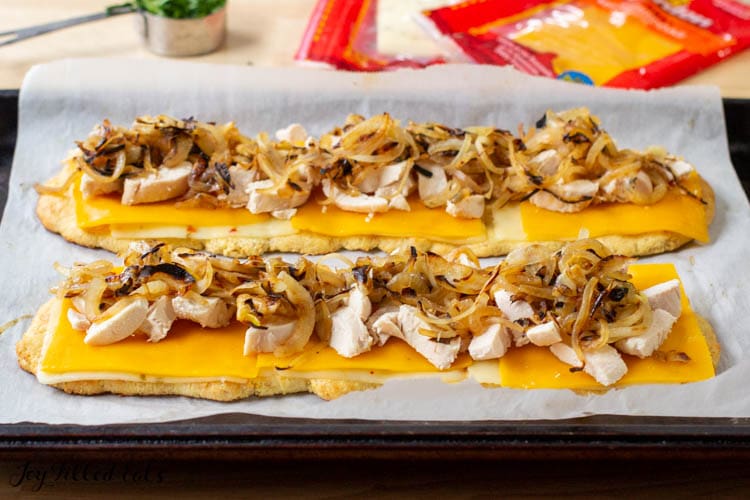 flatbreads topped with chicken and onions