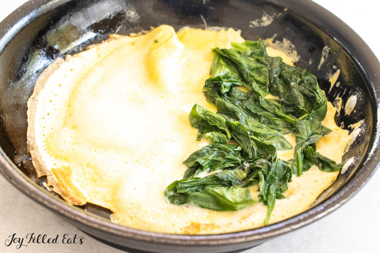 spinach added to half the omelet