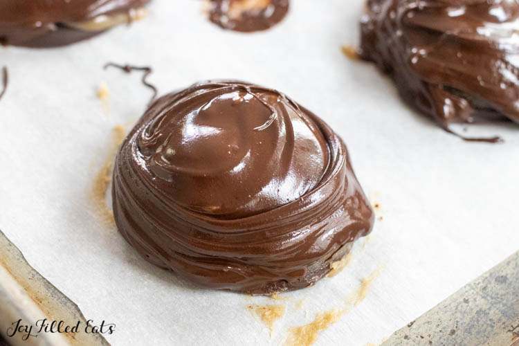 melted chocolate swirled on top of candy