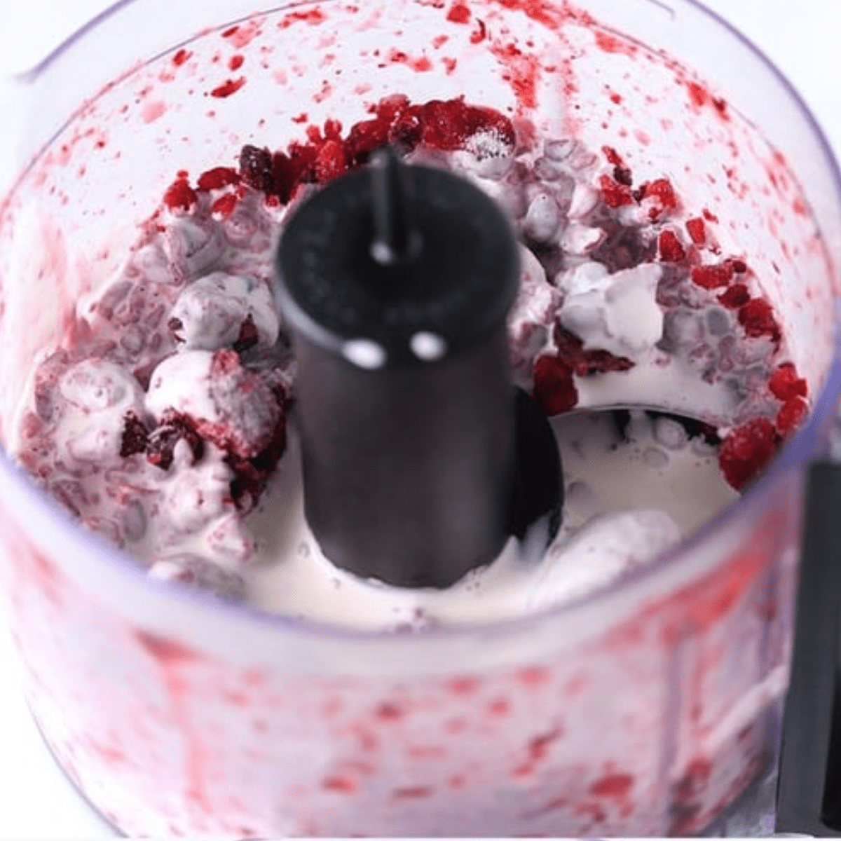 heavy cream and berries in food processor
