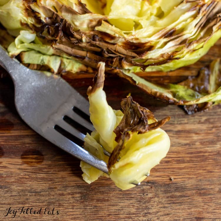 bite of air fried cabbage on fork