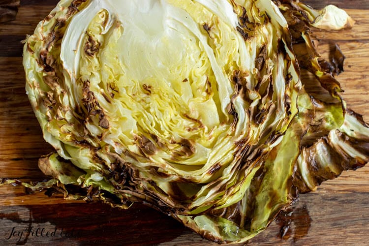 air fryer cabbage on wooden board showing crispy edges