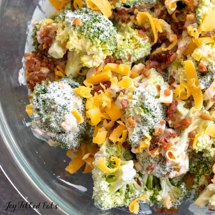 overhead close up shot of keto broccoli salad showing cheese and bacon