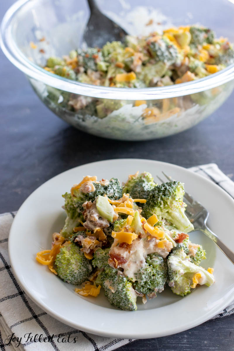 keto broccoli salad on plate and in bowl behind