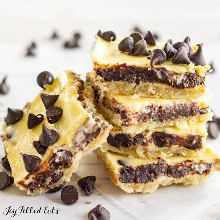 close up of a stack of keto chocolate chip cheesecake bars with on its side