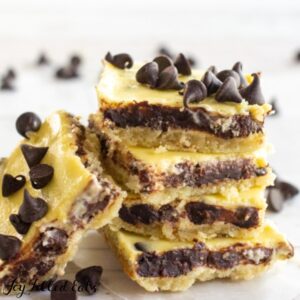 close up of a stack of keto chocolate chip cheesecake bars with on its side