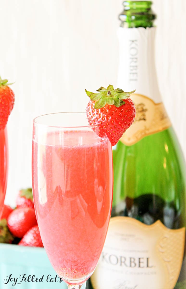 glass with strawberry keto mimosa