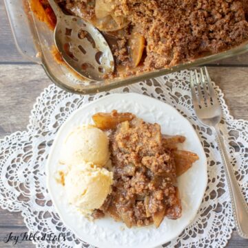 keto apple crisp in a baking dish and served on a plate with ice cream