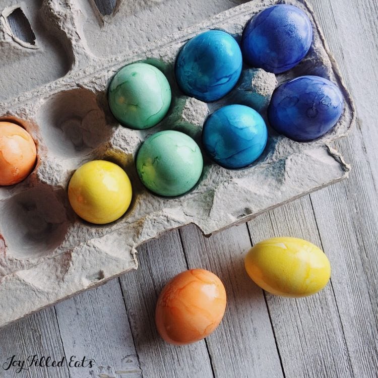 dyed eggs in carton