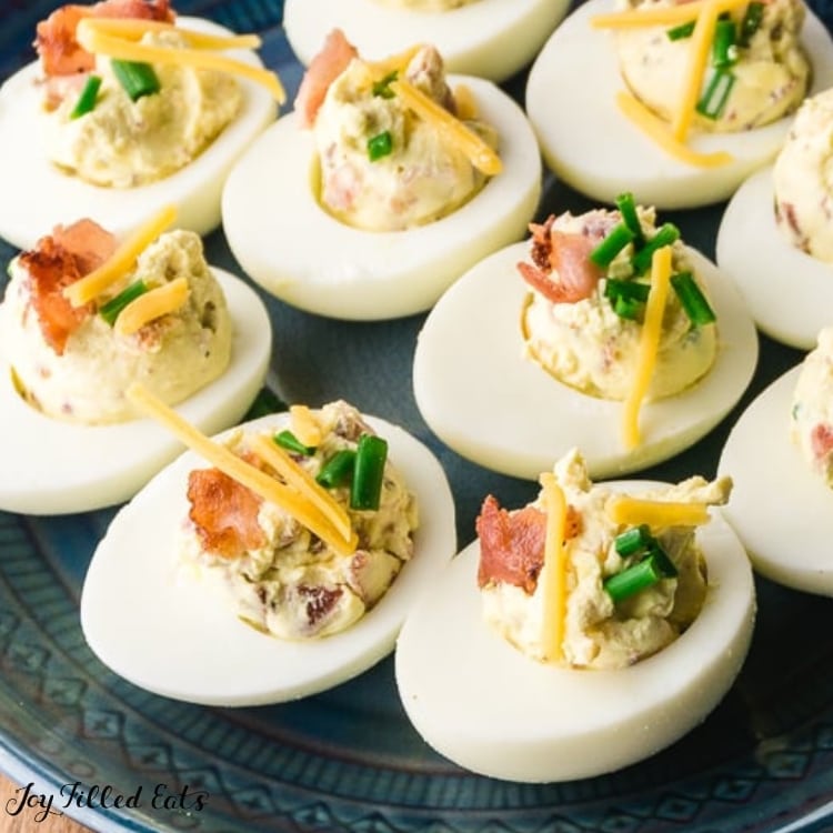 close up of deviled eggs with bacon