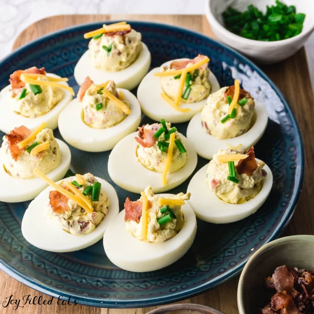 keto deviled eggs on round blue plate