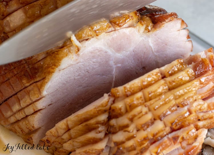 close up of keto glazed ham being sliced
