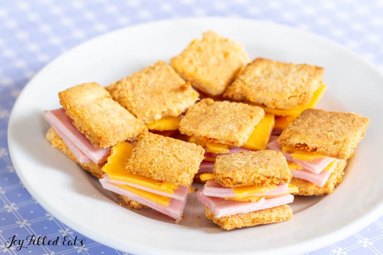 plate with small sandwiches made with keto cheez its crackers, ham, and cheese