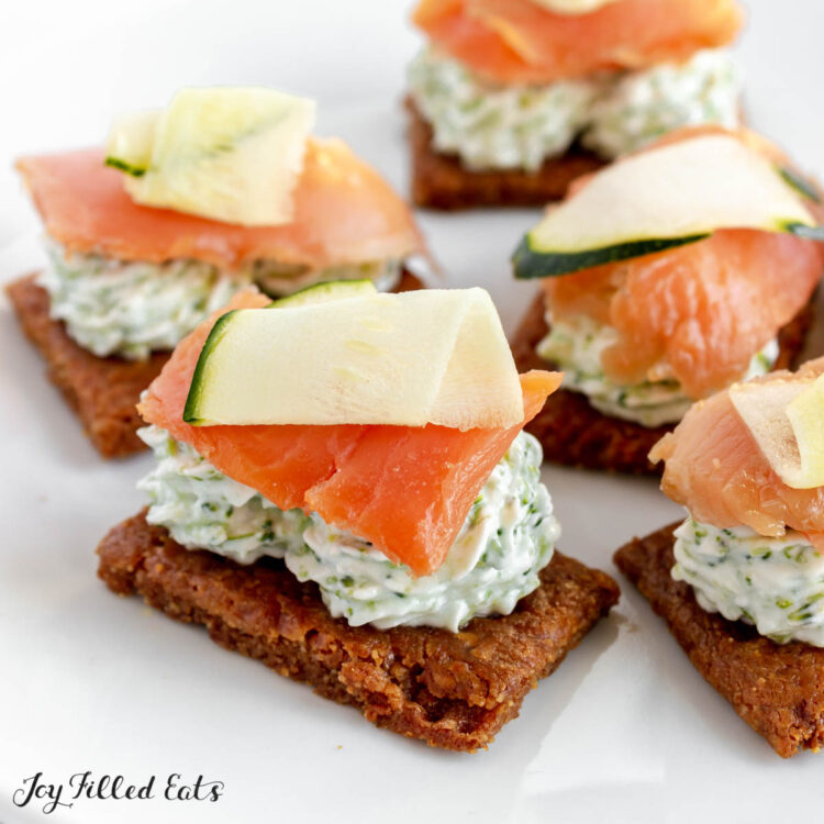 plate of smoked salmon bites on crackers