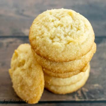 3 ingredient almond flour cookies in a stack close up on top cookie