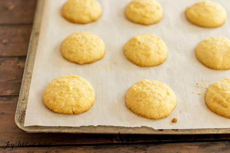 parchment paper lined baking sheet with cookies
