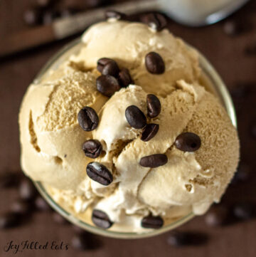 keto coffee ice cream recipe shown scooped in a bowl garnished with coffee beans from overhead