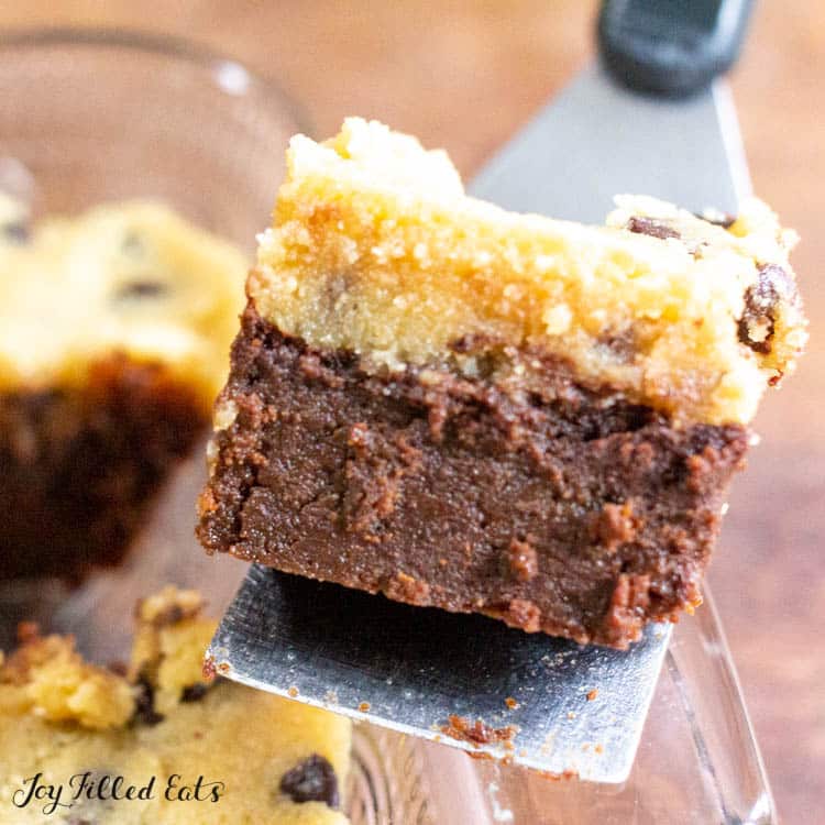spatula lifting low carb brownie with cookie dough out of pan