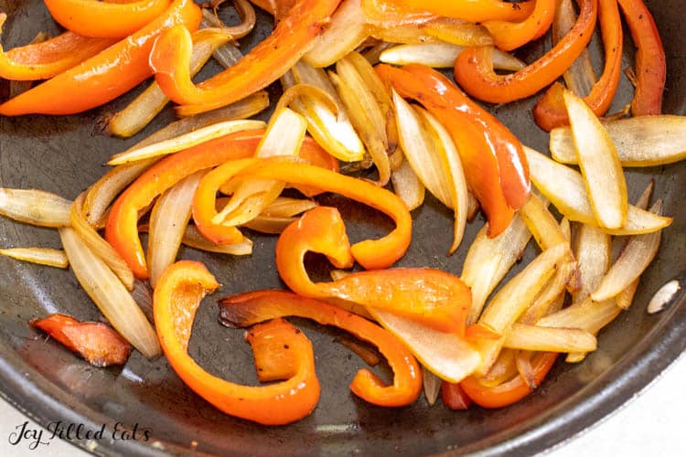 sauteed onions an peppers in pan