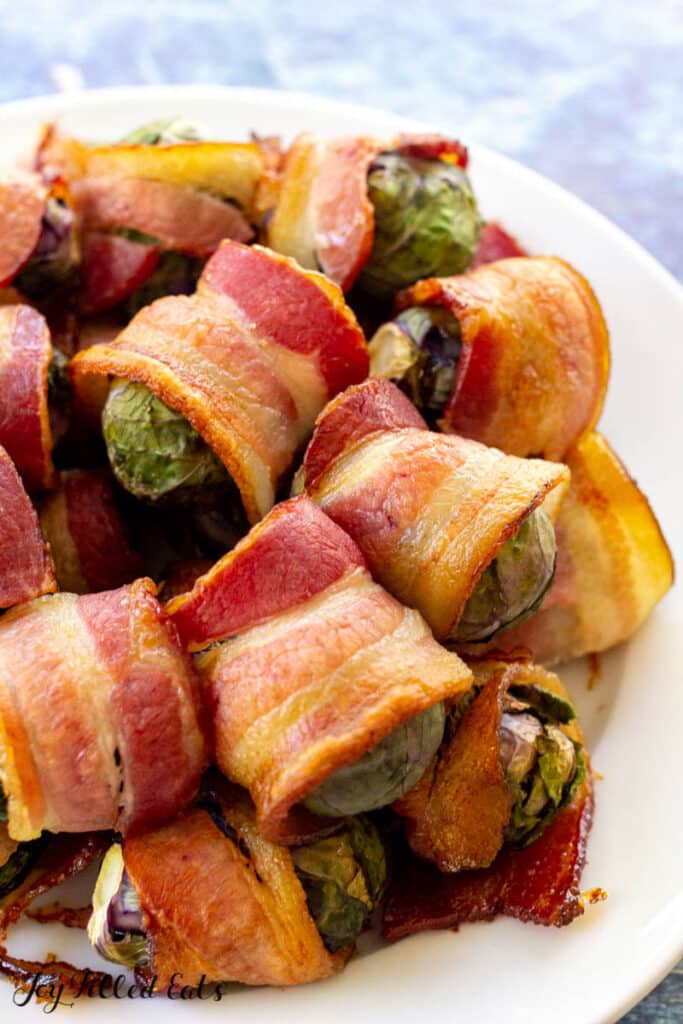 brussel sprouts wrapped in bacon on plate