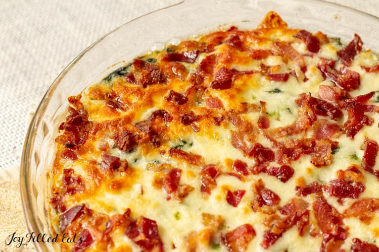 close up on melted cheese and bacon crumbles