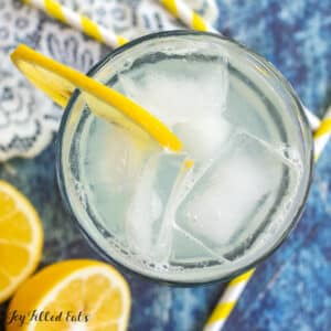 keto sugar free lemonade recipe shown from overhead in a glass with a slice of lemon