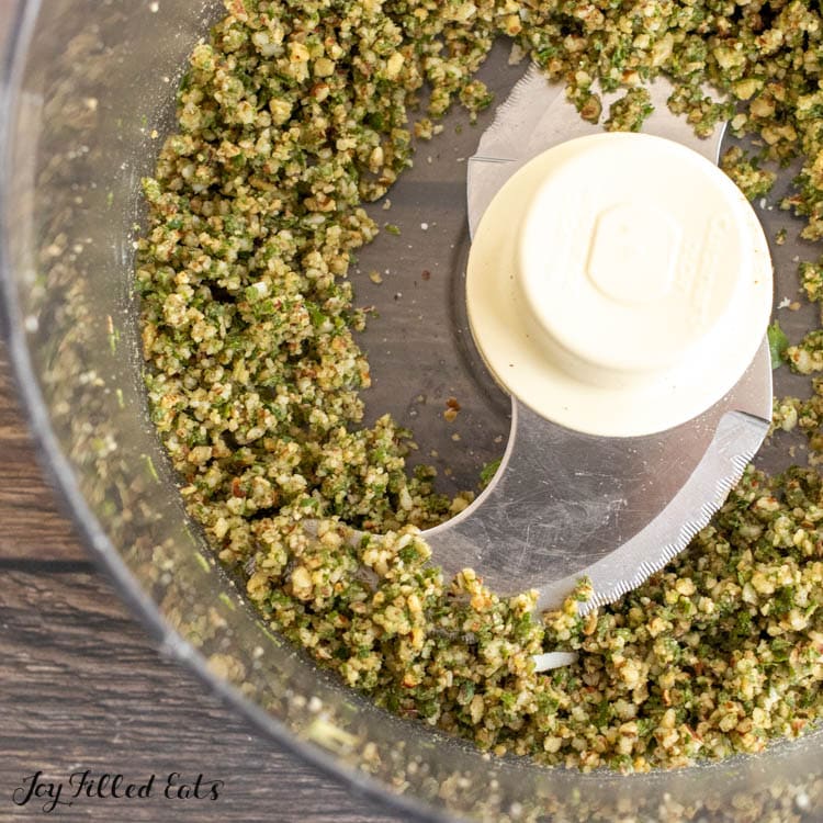 chopped oregano, nuts, and cheese in food processor