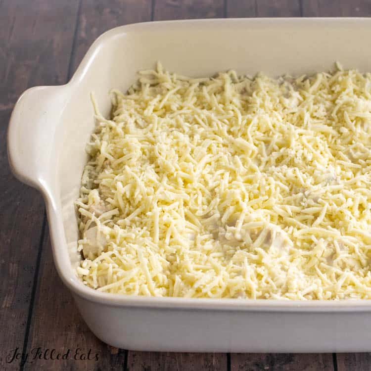 close up shredded mozzarella cheese on top of the casserole