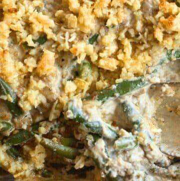 keto green bean casserole recipe in baking dish with spoon shown close up