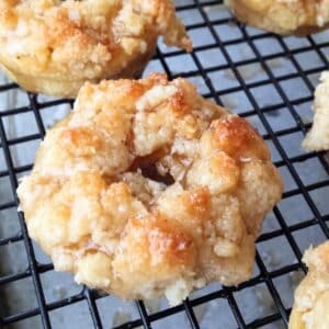 keto donut recipe made into glazed crumb donuts on cooling rack with glaze