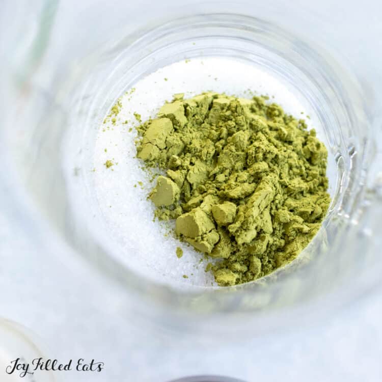 green powder in glass mug